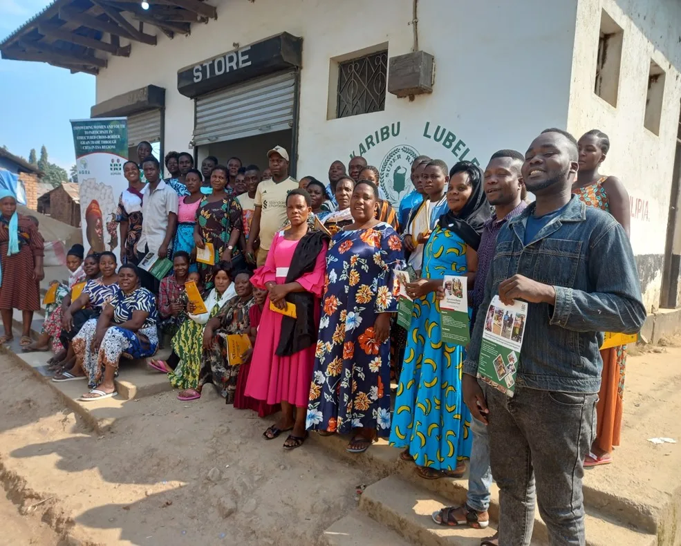 Kasumulu CBTA members at a rice miller managed by women in Kasumulu, Tanzania